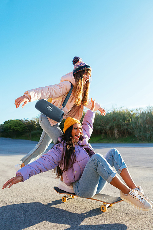 Teenagers having fun with a skate on a sunny winter day.